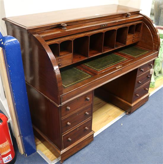 A Victorian mahogany cylinder roll top desk W.133cm.